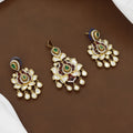 Traditional Floral Kundan Pendant & Earrings Set with Green Emerald Accents