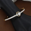 Gold Oval Solitaire Bangle Bracelet with White Inlay