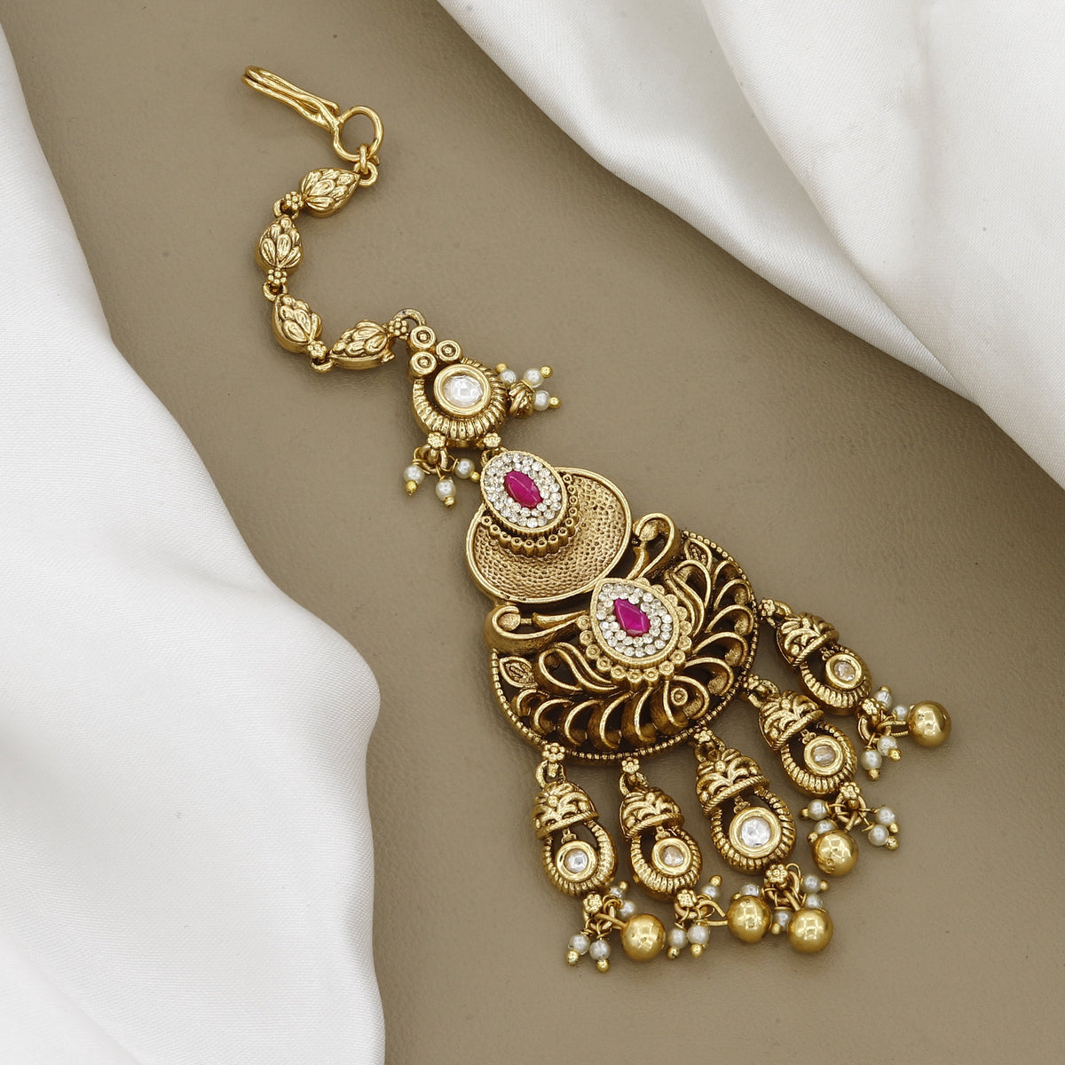 Antique Gold-Plated Maang Tikka with Pink Stones and Pearl Droplets