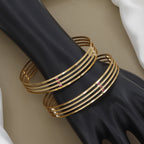 Minimalist Four-Line Gold Toned Bangle Set with Red Stones